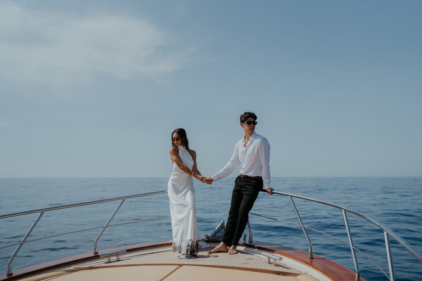 Couple eloping on a boat near Capri during the day
