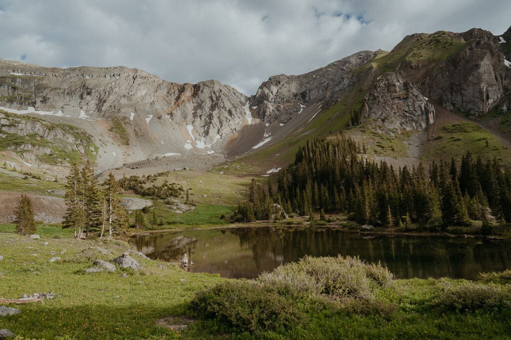 Alpine lake nestled beneath rugged Colorado peaks—an epic and secluded elopement spot in Colorado for adventurous couples.